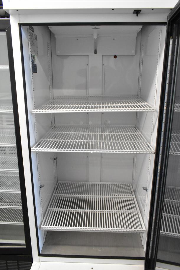 2021 True TSCI-600R-G-PH commercial reach-in cooler, single glass door, poly-coated racks, 115V, excellent condition.