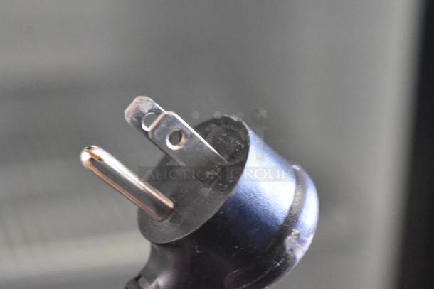 Close-up of the power plug for a 2024 True GDM-35-HC commercial 2-door reach-in cooler, 115 volts, 1 phase.