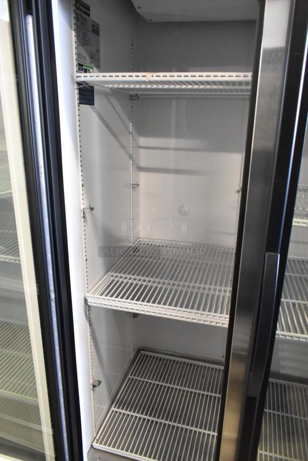 2024 True GDM-35-HC commercial cooler, 2-door, poly-coated racks, 115V, 1 phase, excellent condition, interior view.