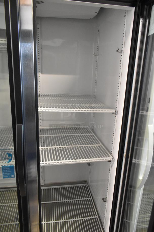 2024 True GDM-35-HC commercial 2-door reach-in cooler with poly-coated racks, 115 volts, excellent condition.