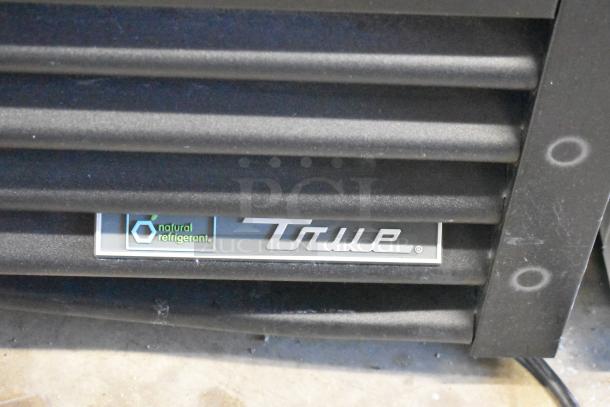 2024 True GDM-35-HC Cooler, logo and "natural refrigerant" label on black vent, for commercial use.
