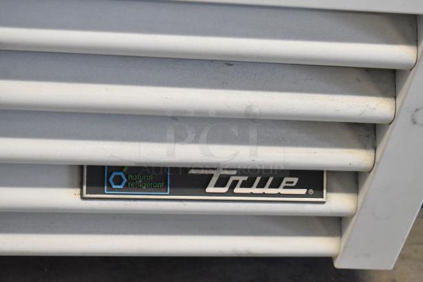 2021 True TSCI-600R-G-PH single door reach-in cooler with natural refrigerant label.