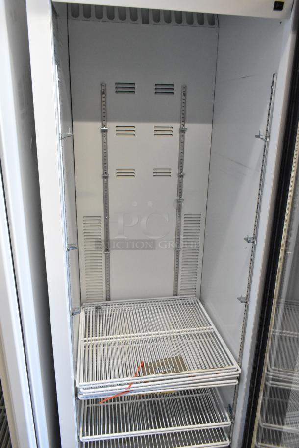 2019 Habco SE18 commercial single door reach-in cooler with poly-coated racks, used condition, 115 volts, 1 phase.