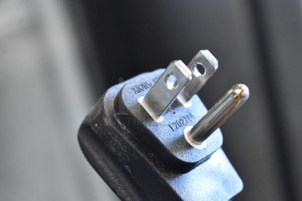 Close-up view of a three-prong power plug. The item is a 2019 Habco SE18 Commercial Cooler, 115 volts, 1 phase.