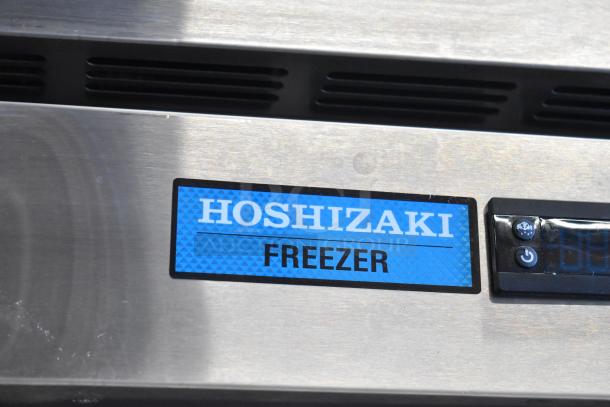 2019 Hoshizaki F2A-FS commercial 2-door reach-in freezer on casters; features label and controls. 115 volts, 1 phase.