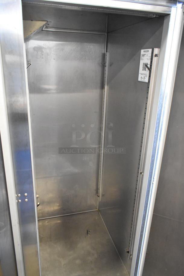 2019 Hoshizaki F2A-FS commercial two-door reach-in freezer interior view, good condition, with labels and commercial casters.