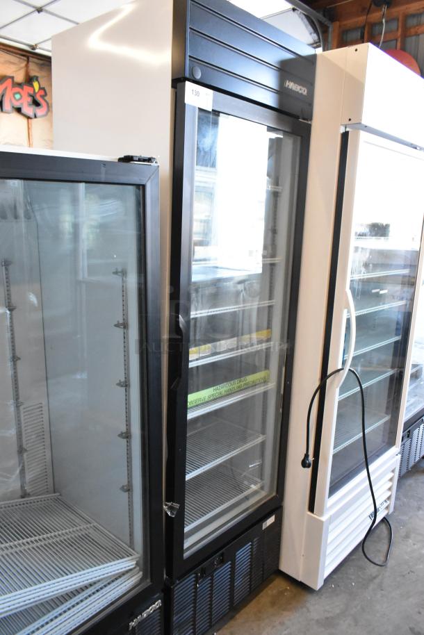 2019 Habco SE18 commercial single door cooler, features poly-coated racks, black trim, and glass door; 115 volts, 1 phase.