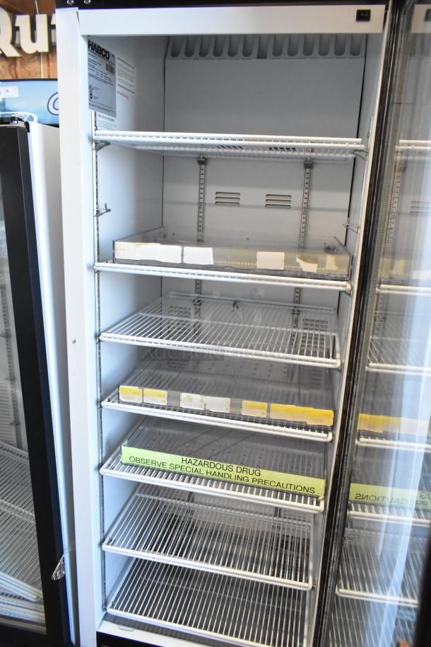 2019 Habco SE18 commercial cooler with single glass door, poly-coated racks, 115V, 1-phase, label indicates handling precautions.