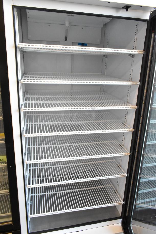 2021 True TSCI-600R-G-PH commercial cooler with glass door and poly coated racks, 115 volts, 1 phase, excellent condition.