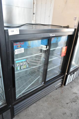 True Commercial 2 Door Reach In Cooler Merchandiser, poly coated racks, 115V, 1 Phase, labeled shelves, glass doors, good condition.
