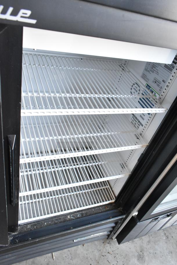 True Commercial 2 Door Reach-In Cooler, poly-coated racks, 115 volts, 1 phase, clean interior, visible model tag.
