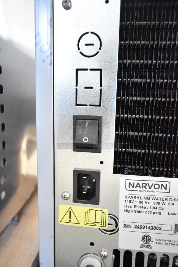 Rear view of brand new Narvon 23BCWD8 water dispenser panel showing power switch, power inlet, and label details.