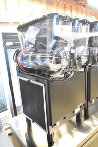 Brand new Sencotel Freazy 2 commercial slushie machine, 2 hoppers, 115 volts, scratch and dent condition, black finish.