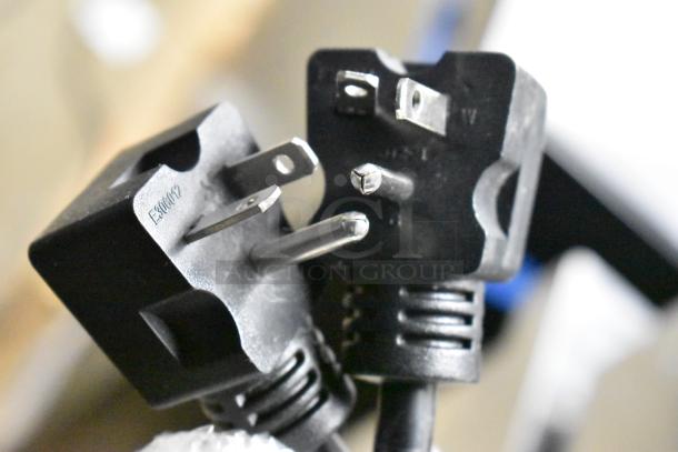 Close-up of the plug for the Avantco 177F202 dual tank electric fryer. Plugs are intact, showing E306612 marking.