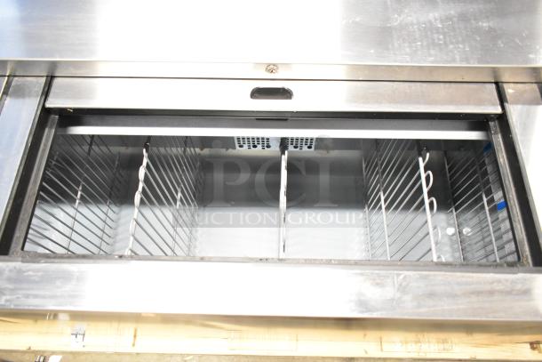 Brand new True TD-80-30-HC commercial black bottle cooler with 3 sliding lids, 115 volts, 1 phase. Visible internal racks.