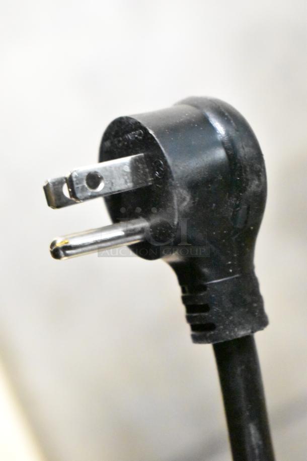 Close-up of a black power plug for the True TD-80-30-HC cooler, featuring three prongs, designed for 115 Volts, 1 Phase.