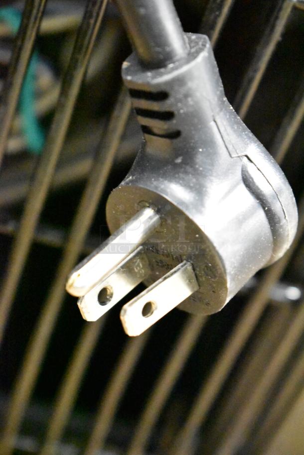 Close-up of a power plug for a True TD-95-38-HC bottle cooler, 115 volts, new condition with minor scratches.