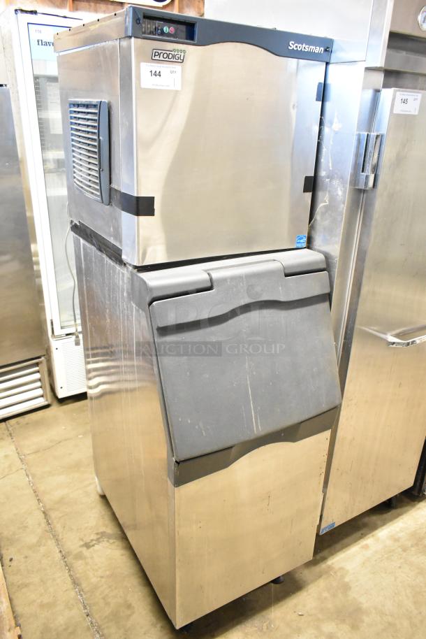 Scotsman C0322SA-1B commercial ice machine with bin, stainless steel, 115V, 1 phase, fair condition, identification tag visible.