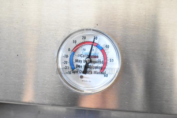 Continental 1R cooler thermometer reading. Markings indicate calibration may be required due to shipping; see owner's manual.