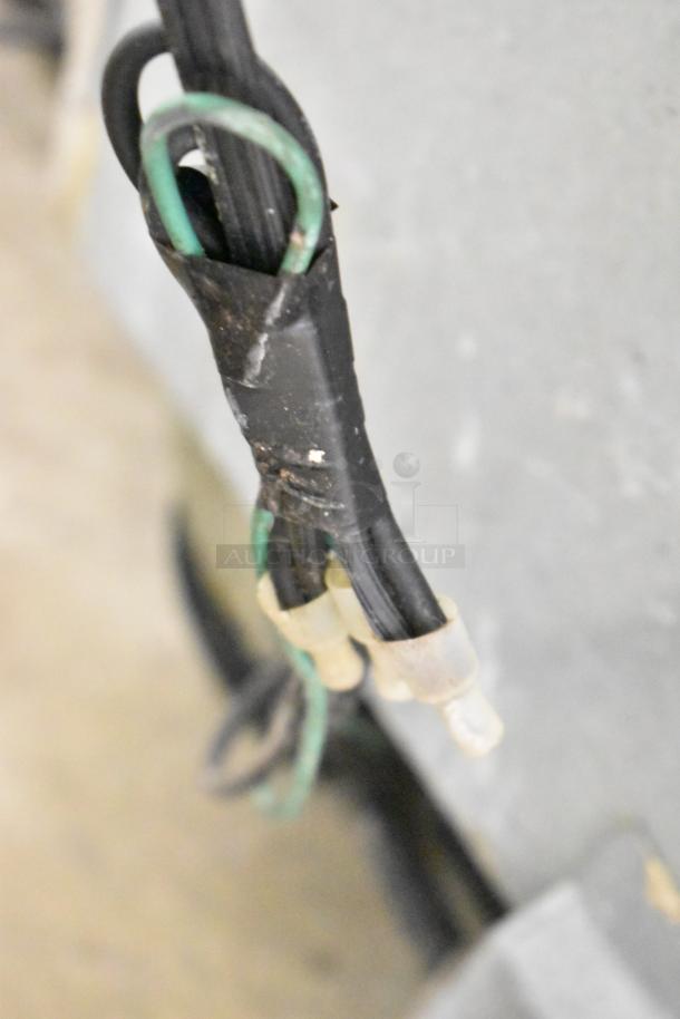 Continental 1R Single Door Cooler, 115V, poly-coated racks, shows cord detail with wear and sealed connections.