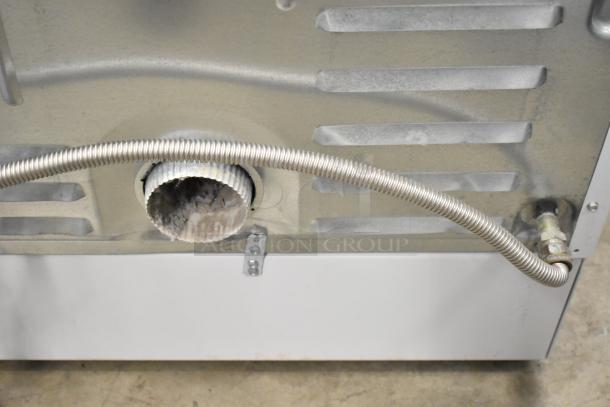 Speed Queen Alliance back panel with vent hose and pipe connections for front load washer AFN50FSP111TW01 and dryer ADG4BFGS111TW01.
