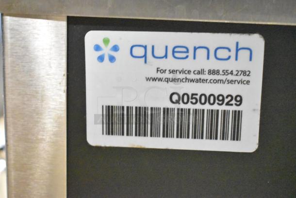 Vero Commercial Countertop Water Dispenser with Quench service label. Item in good condition, service call number visible.