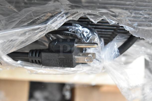 Alt text: Close-up of power cord for Avantco 193BC72HCB bakery display case, wrapped in plastic packaging.