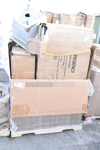 Pallet of boxed items including sinks and pan racks marked "Regency"; boxes in varied scratch and dent condition.