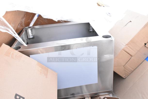 Stainless steel sink, new with minor scratches, boxed. Part of a 13-item scratch and dent auction lot.
