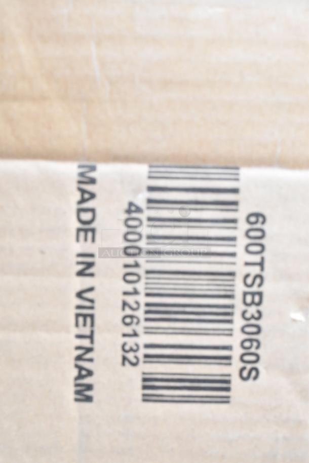 Cardboard box with barcode and text "Made in Vietnam," SKU 600TSB3060S, suggesting a shipment of scratch and dent items.