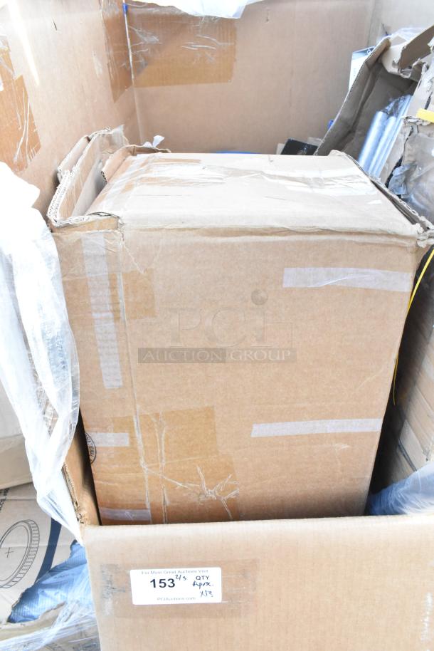 Cardboard box labeled "153" with other boxes and items visible in the background, including a blue chair and pan racks.