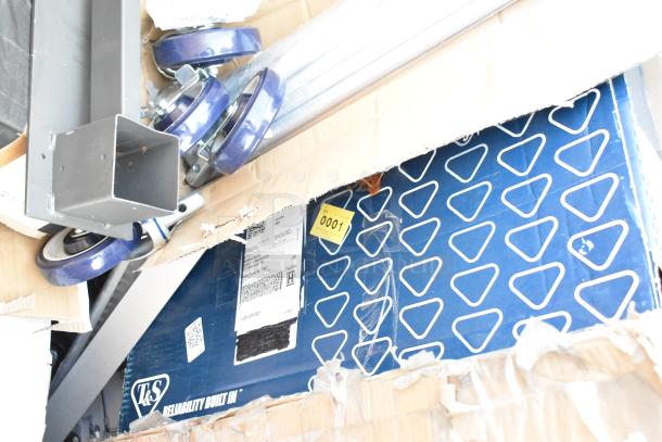 Box of new scratch and dent items including blue wheels, metal frames, and packaging with labels.