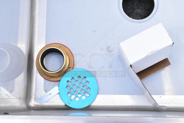 Brand new Regency 600SM242412 29" stainless steel floor mop sink, 24" x 24" x 12", includes components, minor scratches.