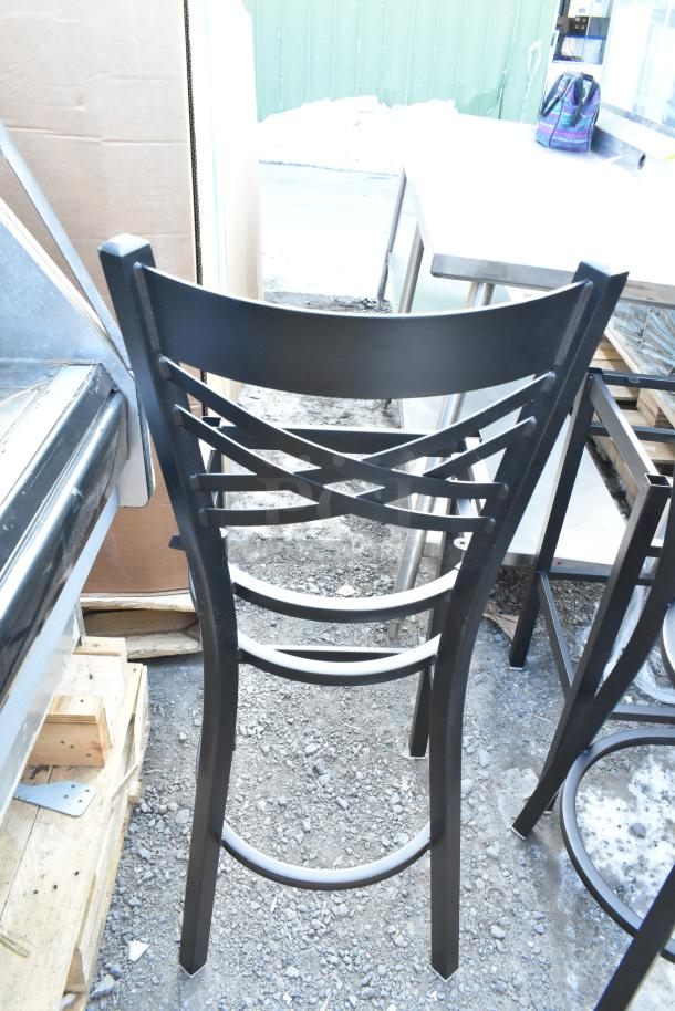 Black metal cross back bar height chair frame, new with scratch and dent condition. No visible tags.