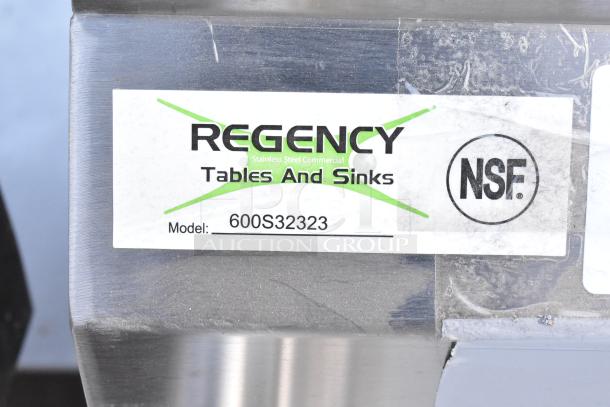 Regency 600S32323 commercial sink tag, NSF certified, 16-gauge stainless steel, model details visible.