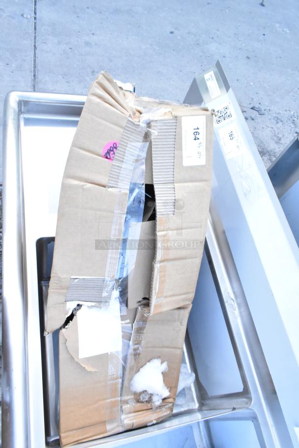 Brand new Vulcan 426983-G1 Legs Stack Set, scratch and dent condition, in damaged cardboard box with visible labels.