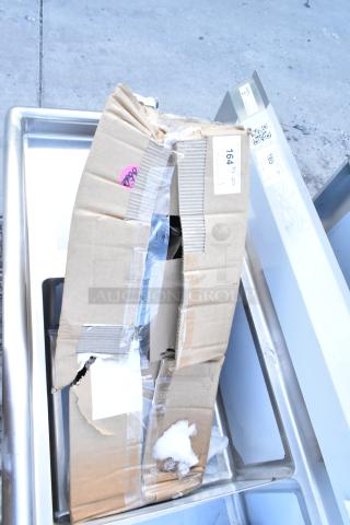 Brand new Vulcan 426983-G1 Legs Stack Set, scratch and dent condition, in damaged cardboard box with visible labels.