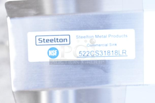 Steelton 522CS31818LR stainless steel 3 bay sink with dual drain boards, brand new scratch and dent, NSF certified label visible.