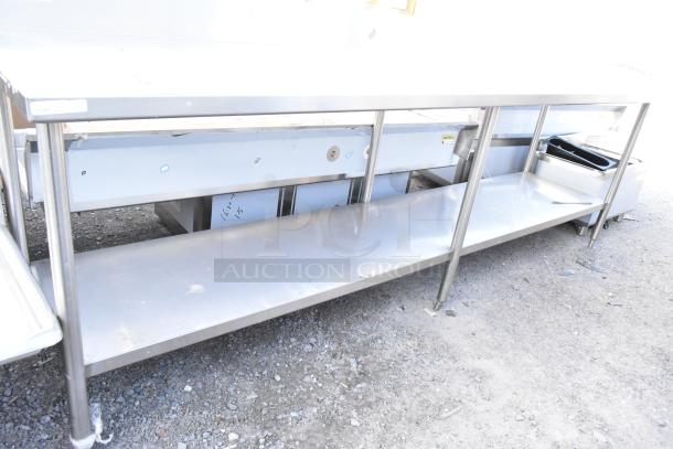 Winholt stainless steel table with under shelf and back splash, showing durable construction and spacious design.