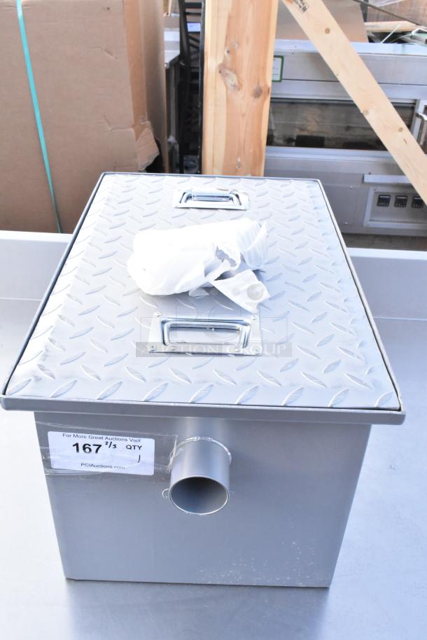 Stainless steel grease trap with checker plate lid, side outlet, and dual handles. Label indicates auction lot 167.