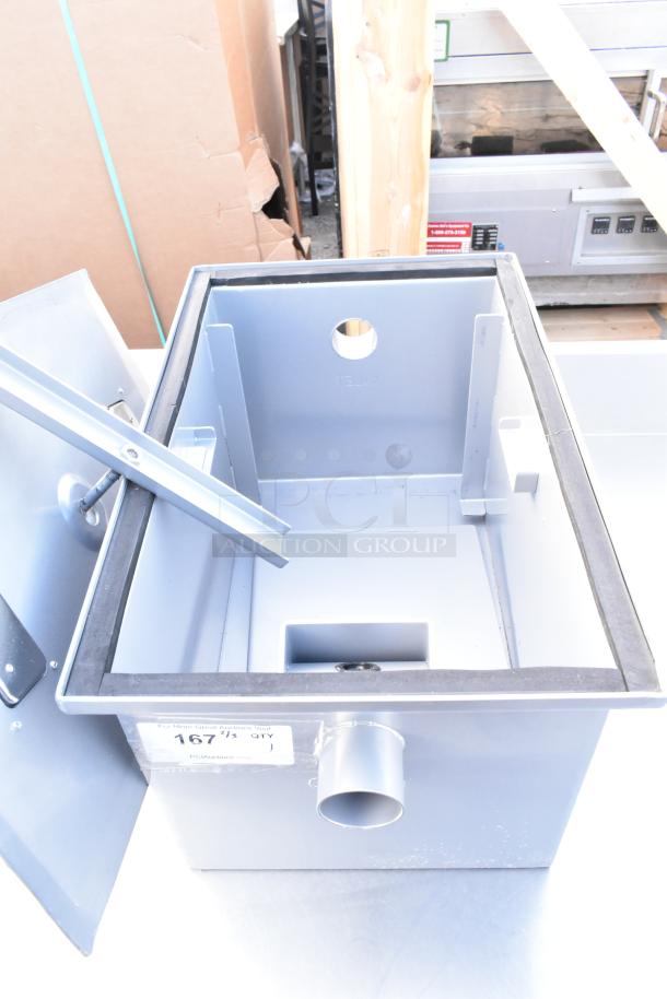 Stainless steel grease trap with side inlet, open lid, and visible label "167 QTY." Used condition.