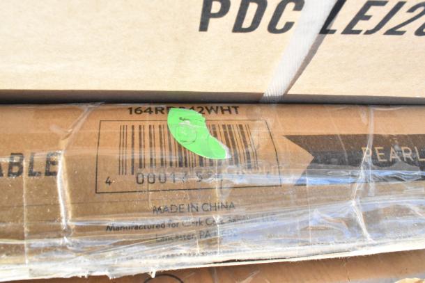 Cardboard box with label "164R 2412 WHT," includes barcode and "Made in China" text. Green sticker partially seen.