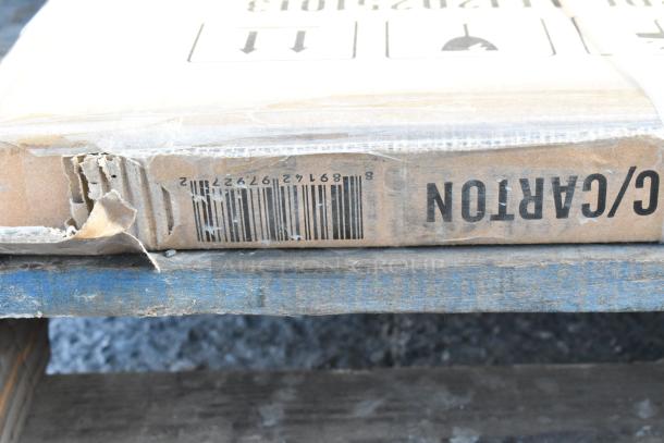 Damaged cardboard box labeled "CARTON" with visible barcode on a blue pallet, indicating a scratch and dent item.
