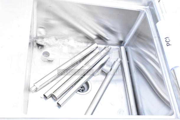 Brand new Regency 600S1242418L stainless steel single bay sink with scratches and dents, featuring left side drain board.