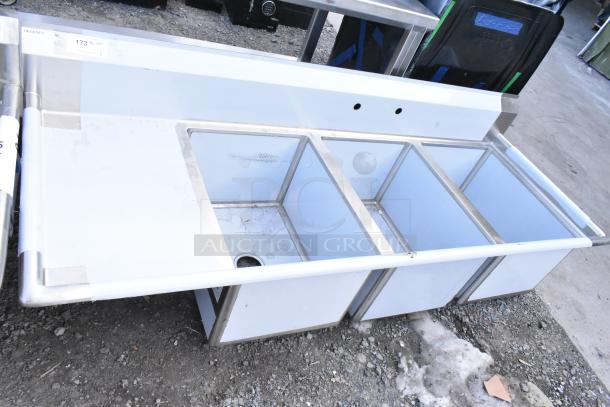 Brand new Regency 600S3182418L stainless steel 3 bay sink, left drain board, no legs, visible scratches and dents.