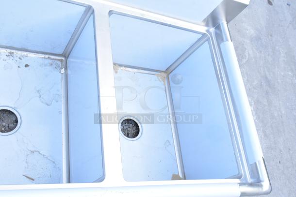 Brand new Regency 600S3182418L stainless steel 3 bay sink with left drain board; no legs; minor scratches.