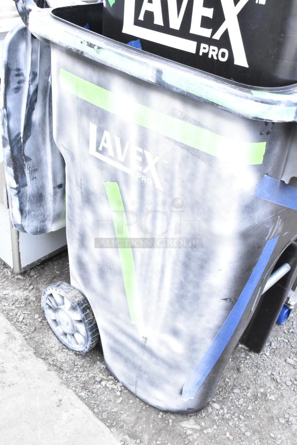 Black Lavex Pro poly trash can with visible scratches and dents, brand name displayed. Auction for 2 new cans.