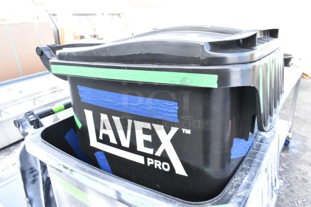 2 new Lavex black poly trash cans with some scratches and dents. Features secure lids and sturdy handles.