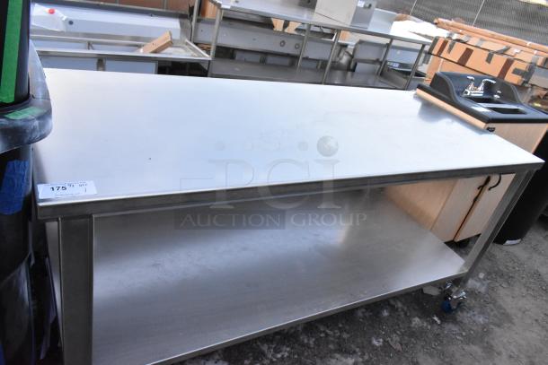 Brand new stainless steel table with under shelf, commercial casters, slight scratches, priced at $175.