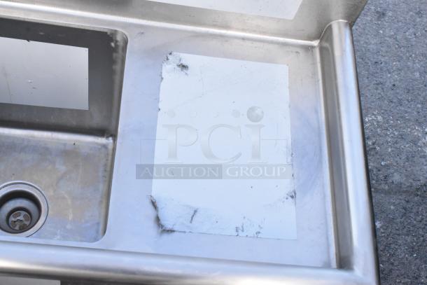 BRAND NEW Regency 600S3141414C stainless steel L-shaped 3-bay sink with dual drain boards, scratch and dent condition.